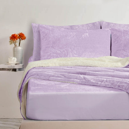 Green/tan velvet bedspread on bed with neutral bedroom decor