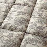 A close-up of a white and gray floral patterned fabric.