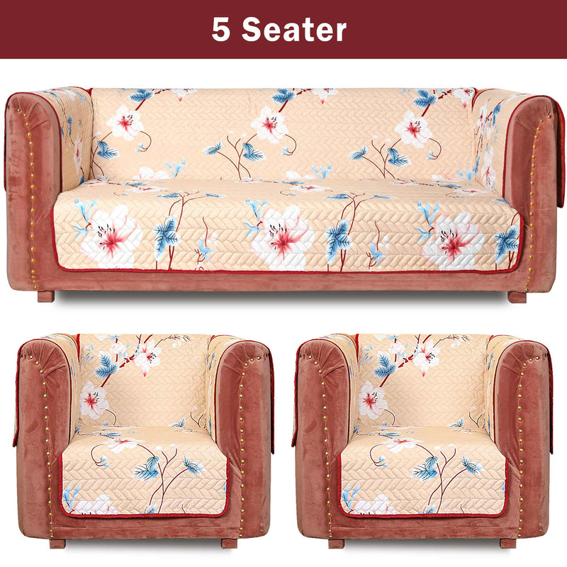 Close-up of quilted floral fabric on curved edge of sofa arm cover