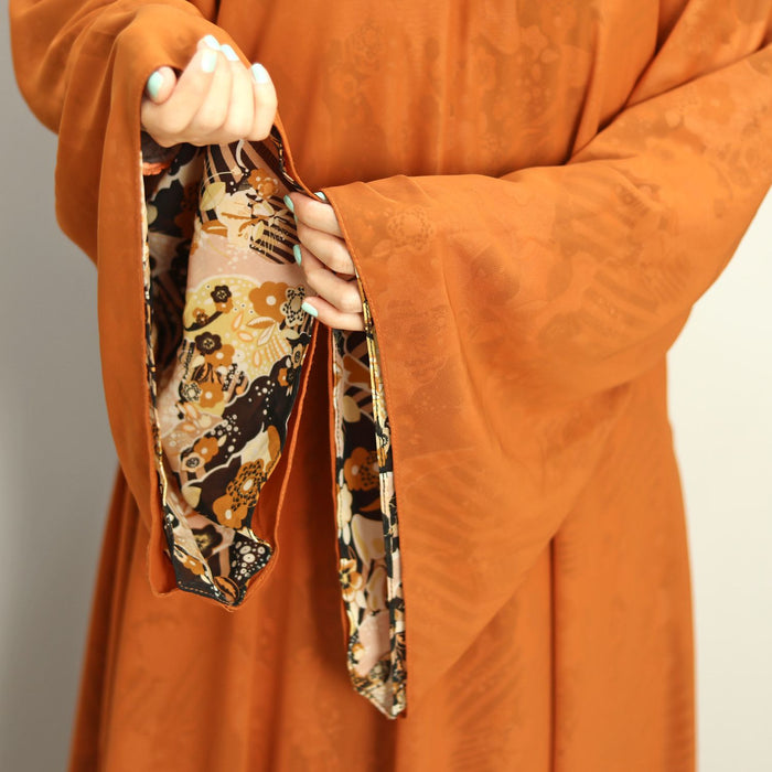 orange printed abaya and hijaab