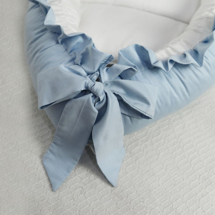 blue ruffled baby snuggle bed